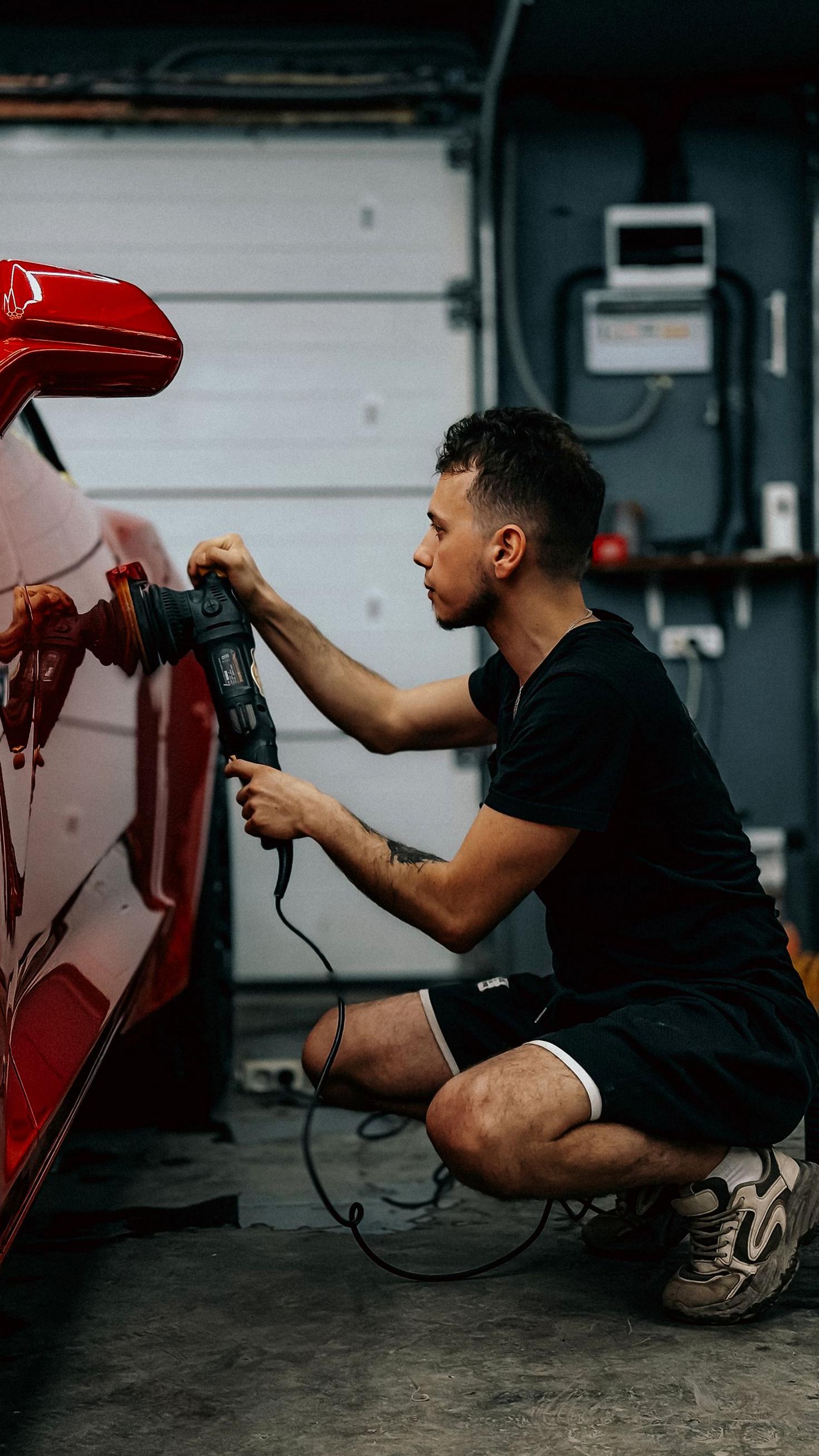 Polishing red sports car